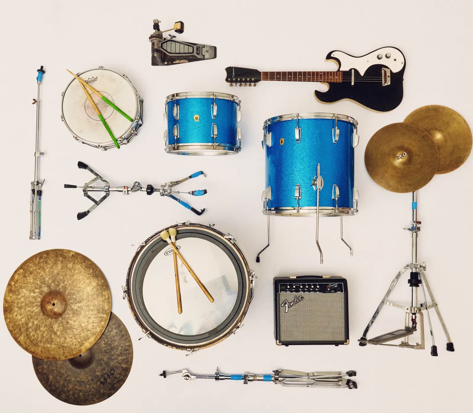 Graham Hill’s drum kit and guitars laid out from above on a pale floor