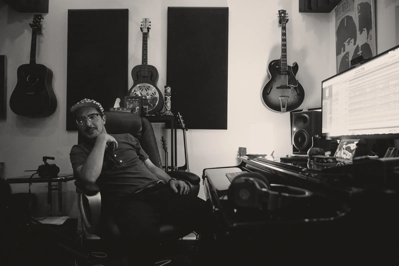 Black-and-white photo of Graham Hill at the mixing desk at Mid City Sound